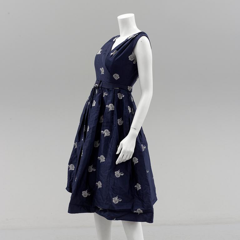 A Christian Dior 1950s midnight blue cocktail dress.