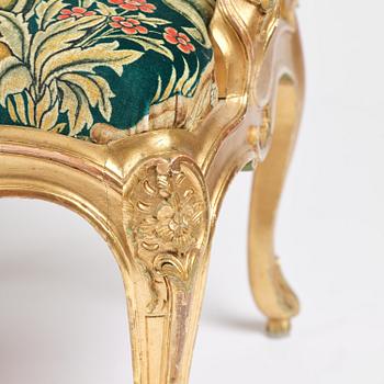 A pair of Louis XV-style giltwood fauteuils, late 19th century.