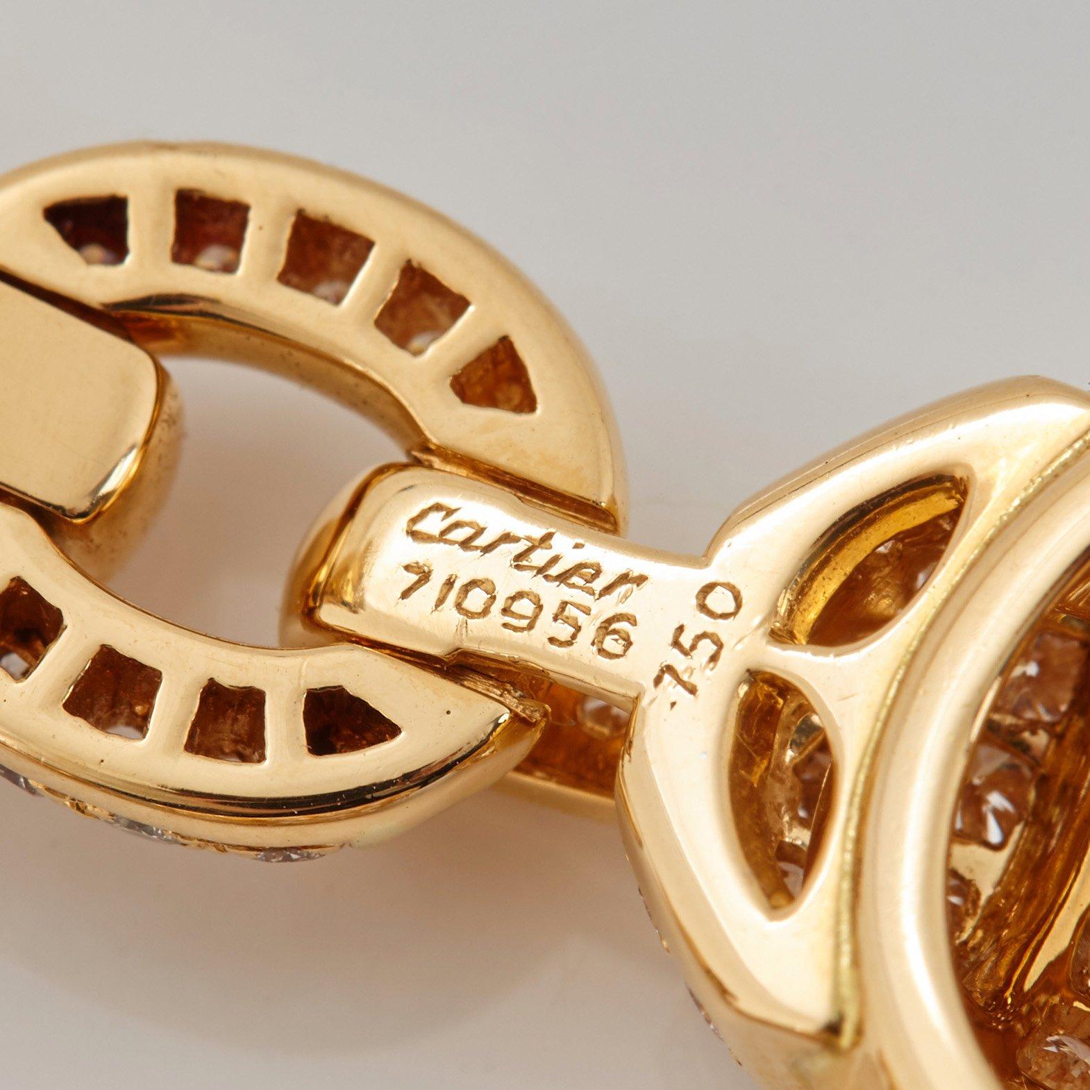 Cartier ett par örhängen 18K guld med runda briljantslipade diamanter.