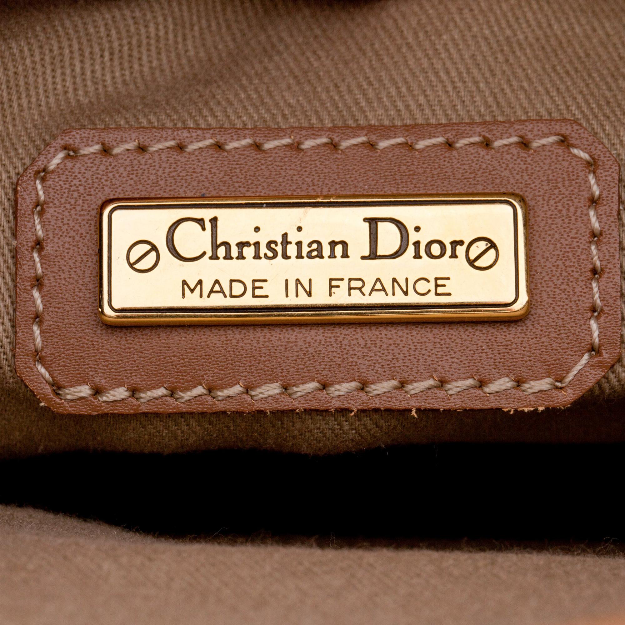 CHRISTIAN DIOR, a brown bag briefcase.