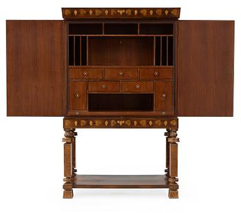 274. A Gösta Thorell cabinet on stand, Stockholm 1929, executed by Georg Ryman.