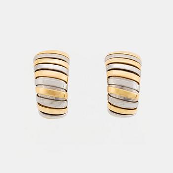 381. A pair of Bulgari "Tubogas" earrings in 18K gold and steel.