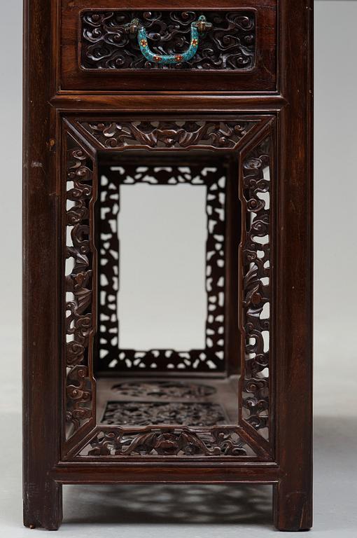 A carved hardwood desk, late Qing dynasty, circa 1900.