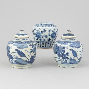 A pair of Chinese blue and white jars with covers, and one jar, Ming dynasty (1368-1644).