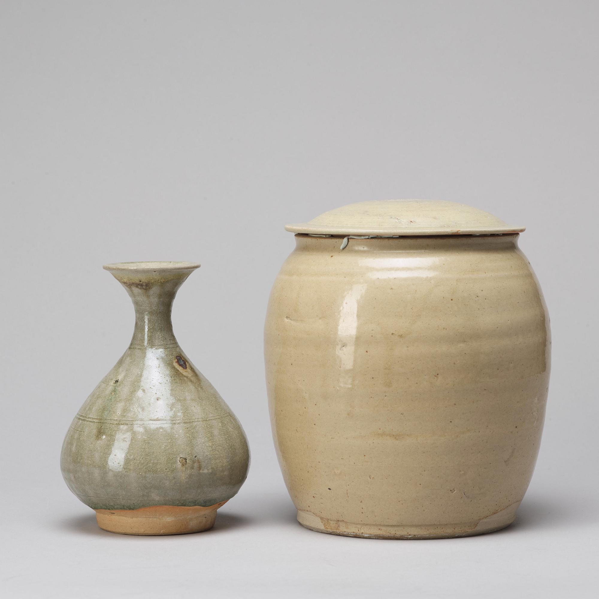 A celadon glazed jar with cover and a vase, South East Asia, 16/17th Century.