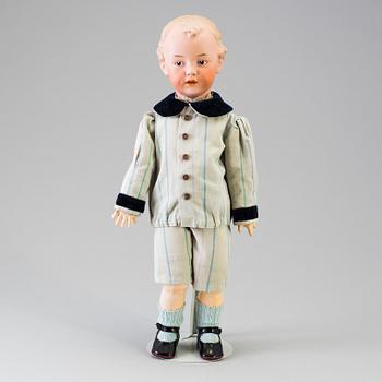 A bisque headed boy doll 7622 by Heubach, Germany, ca 1912.