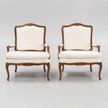 A pair of Rococo style armchairs, later part of the 20th century.