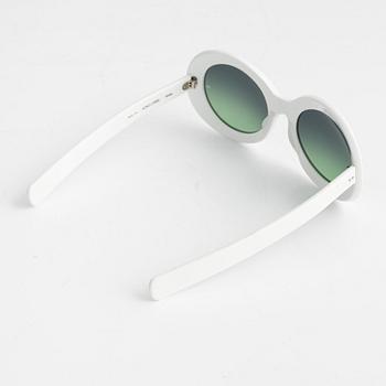 Oliver Goldsmith, a pair of white "Koko" sunglasses.