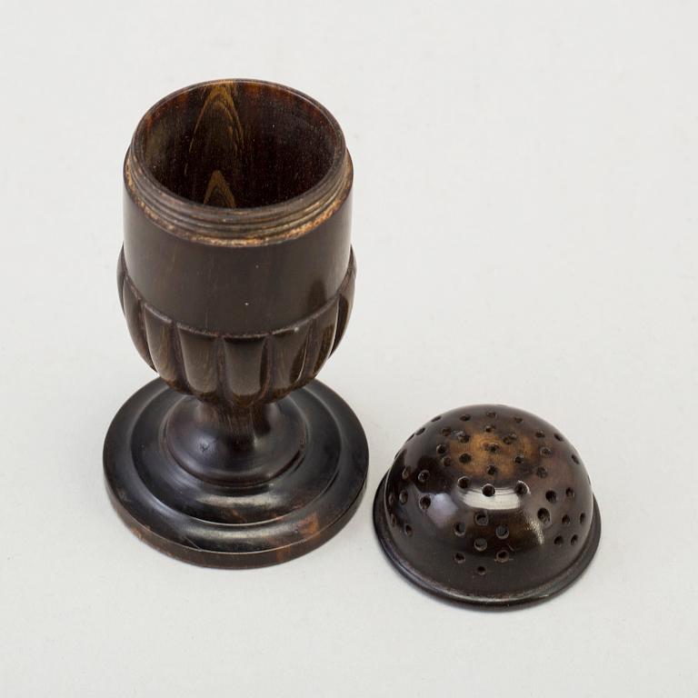 A 18th Century horn saltshaker.