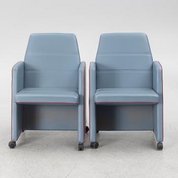 A pair of 1980s armchairs.