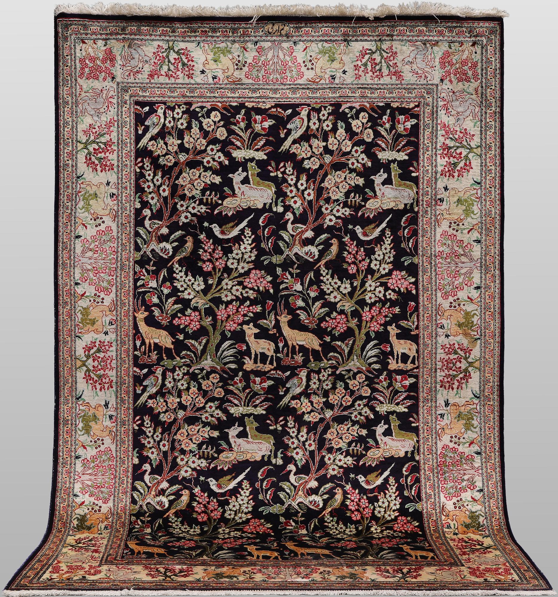 A silk Ghom rug, 155 x 100 cm.