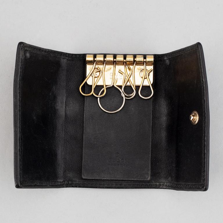 Gucci, ipad-case, key-case and mobile-case.