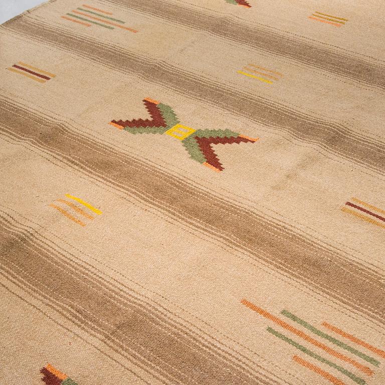 A 1930's Finnish flat weave carpet. Circa 275 x 220 cm.