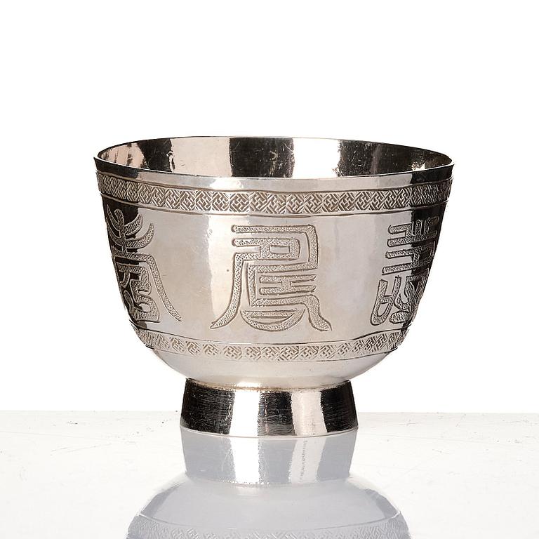 A set of six silver cups with holders, China, 20th century.