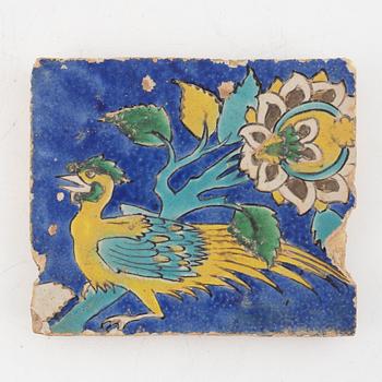 A glazed earthenware tile, Qajar dynasty Persia (Iran), 19th Century.