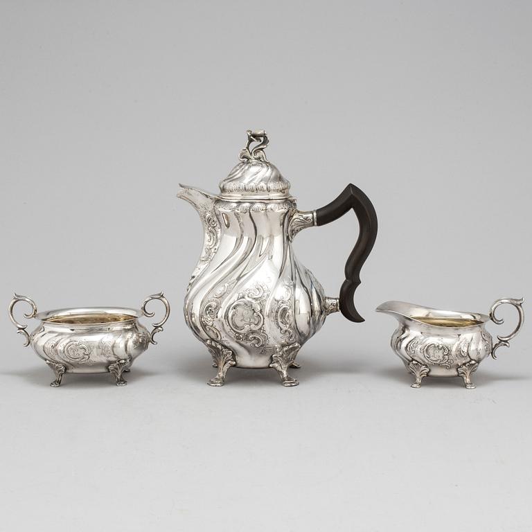 A three-piece silver rococo style coffee service by CG Hallberg, Stockholm, 1948.