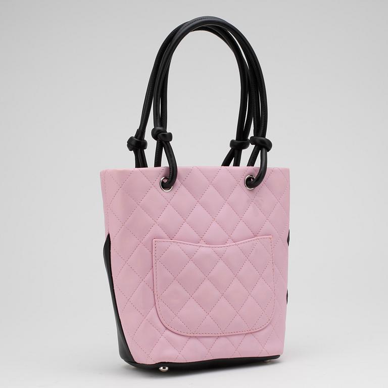 CHANEL, a pink leather "Small Shopping" handbag.