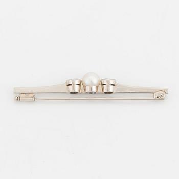 A 14K white gold brooch set with old-cut diamonds and a cultured pearl.