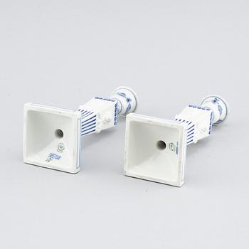 A pair of "Musselmalet" candlesticks in porcelain, by Royal Copenhagen, second half of the 20th century.