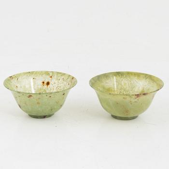 A pair of Chinese green stone bowls.