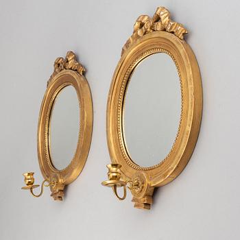 A mirror and a pair of mirror scones, gustavian style, 20th century.