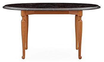 519. A Josef Frank stone top mahogany and walnut table, Svenskt Tenn.
