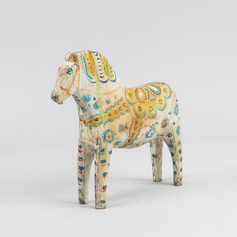 A painted Swedish wooden horse from the first half of the 20th century.