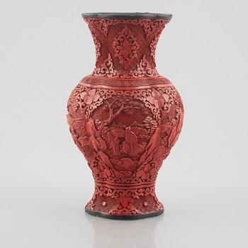 A red laquer vase, early 20th century.