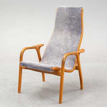 Yngve Ekström, a 'Lamino'  shearling upholstered lounge chair and foot stool from Swedese.