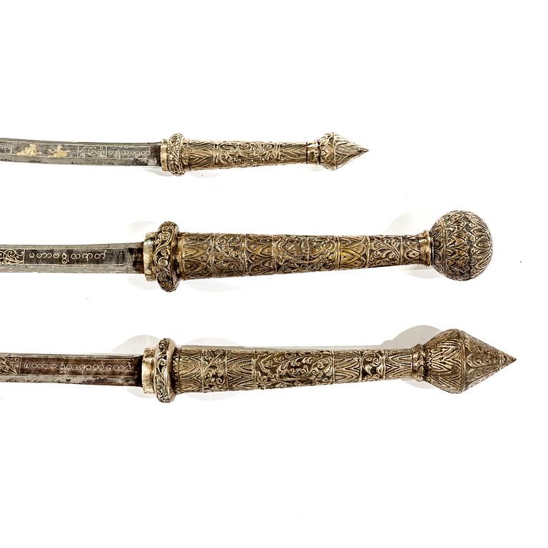 A set of three Burmese 'Dha' swords, late 19th /early 20th Century.