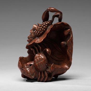 680. A bamboo carving of a crab and lotus, late Qing dynasty.