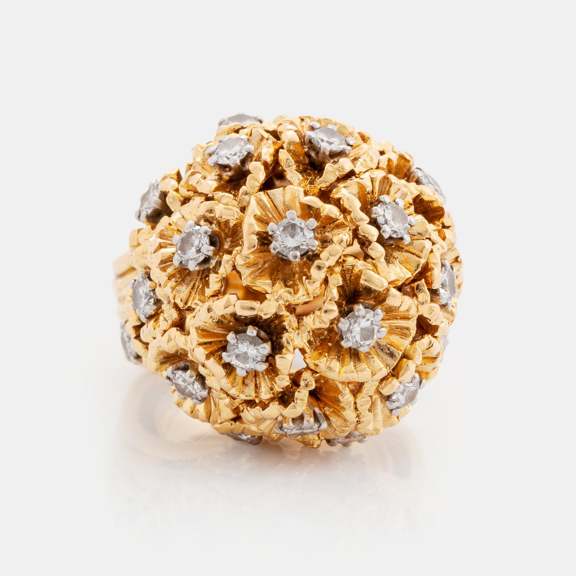A WA Bolin ring in 18K gold set with round brilliant-cut diamonds.