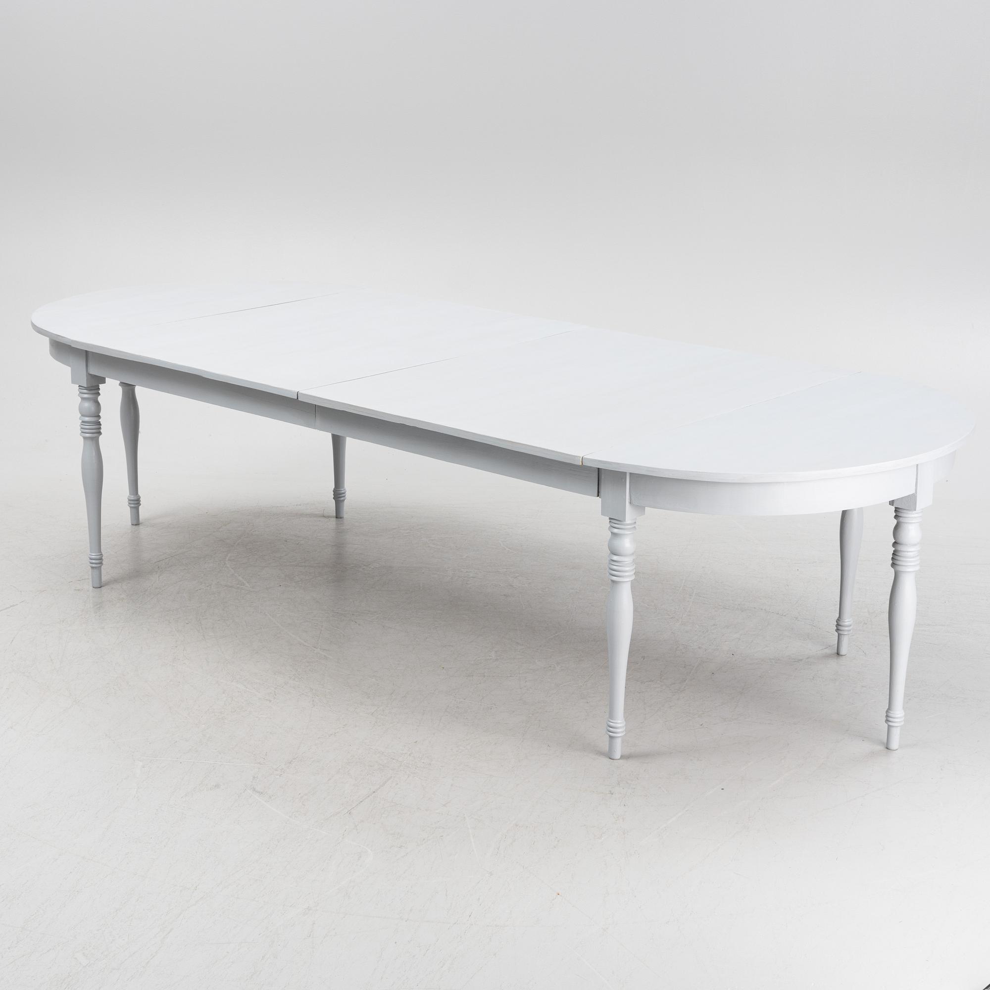 A late 19th century painted dining table.