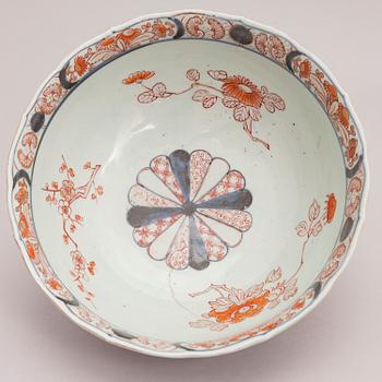 Four Chinese porcelain dishes and a Japanese porcelain bowl, 18th Century.