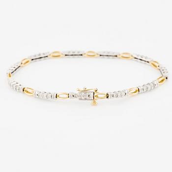Armlänk, 14K guld med briljantslipade diamanter.