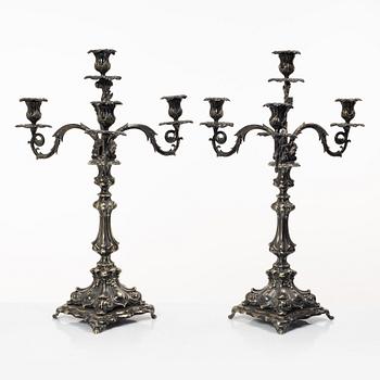 A pair of silver plated Rococo style candelabra, 20th century.