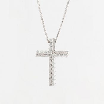 Brilliant cut diamond cross necklace.