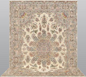 A Kirman Laver carpet, approx. 367 x 267 cm.