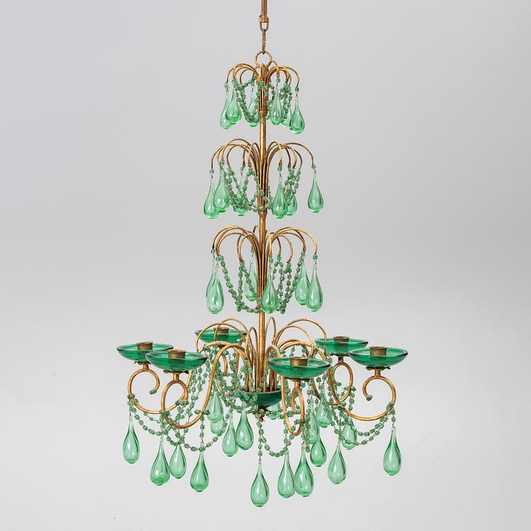 A chandelier, likely from Italy, circa 1950.