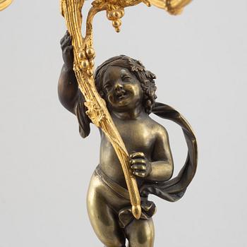 A pair of bronze and marble candelabra, possibly France, late 19th century.