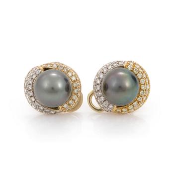 A pair of cultured tahiti pearl earrings with brilliant cut diamond jackets.