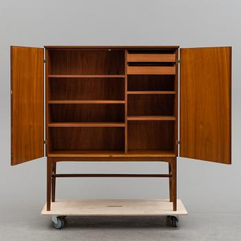 A 1950s mahogany veneered cabinet.