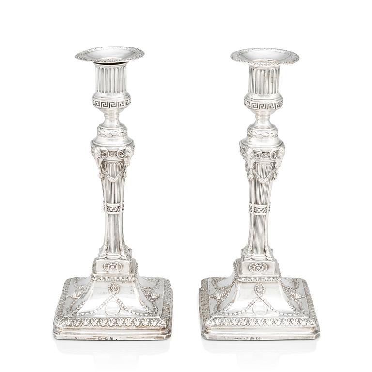 An English pair of 18th Century silver candlesticks, mark of John Winter & Co, Sheffield 1775.