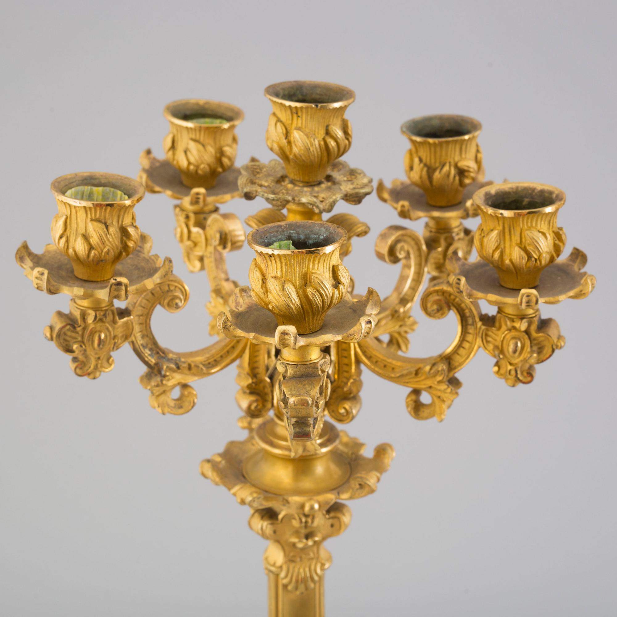 A pair of early 20th century bronze candelabras.