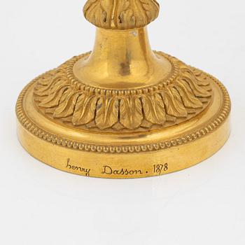 A pair of gilded bronze candelsticks, 19th Century.