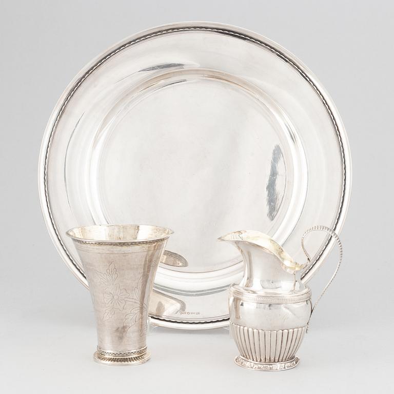 A silver creamer, beaker, and platter, Sweden, 18-19th century.