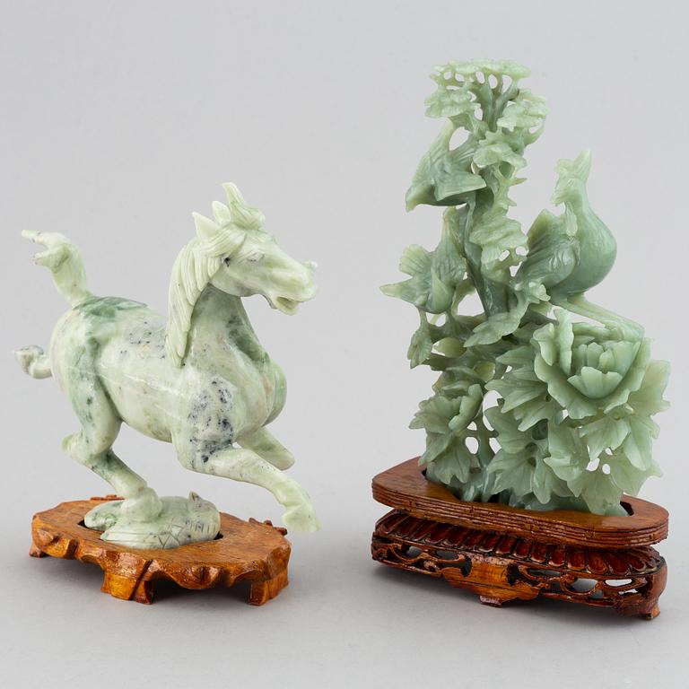 Two Chinese green stone figurines, 20th century.