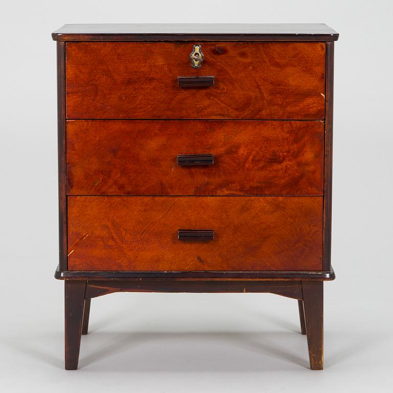 A 1930s functionalist style chest of drawer.