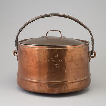 A 18th century copper cauldron.