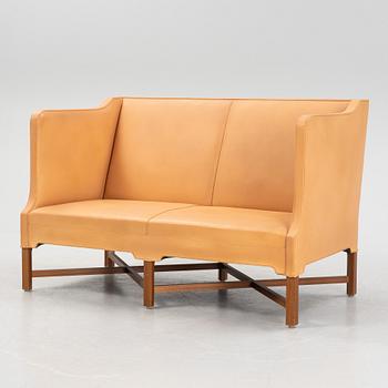 Kaare Klint, a leather upholstered model 4118 sofa, Rud Rasmusseun, Denmark, 1980's.